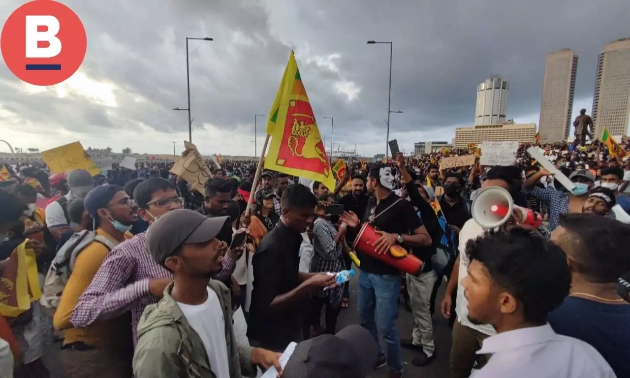 Protesters carrying bullhorns, placards and the Sri Lankan national flag surrounded the Presidential Secretariat building 