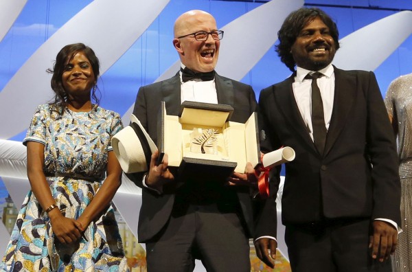 Director Jacques Audiard (C), Palme d'Or award winner for his film 